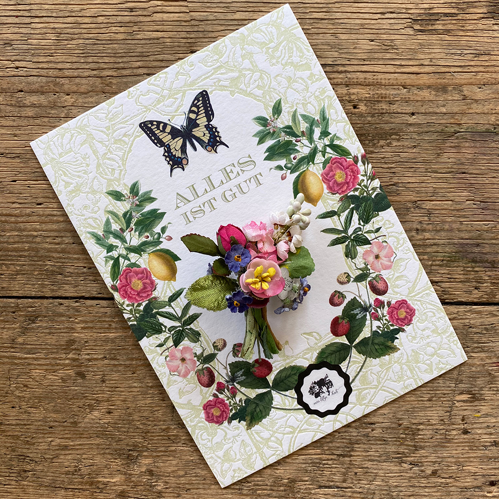 Blumige Grusskarten mit farbenfrohem Sujet und einem Mini als Arm- oder Halsband